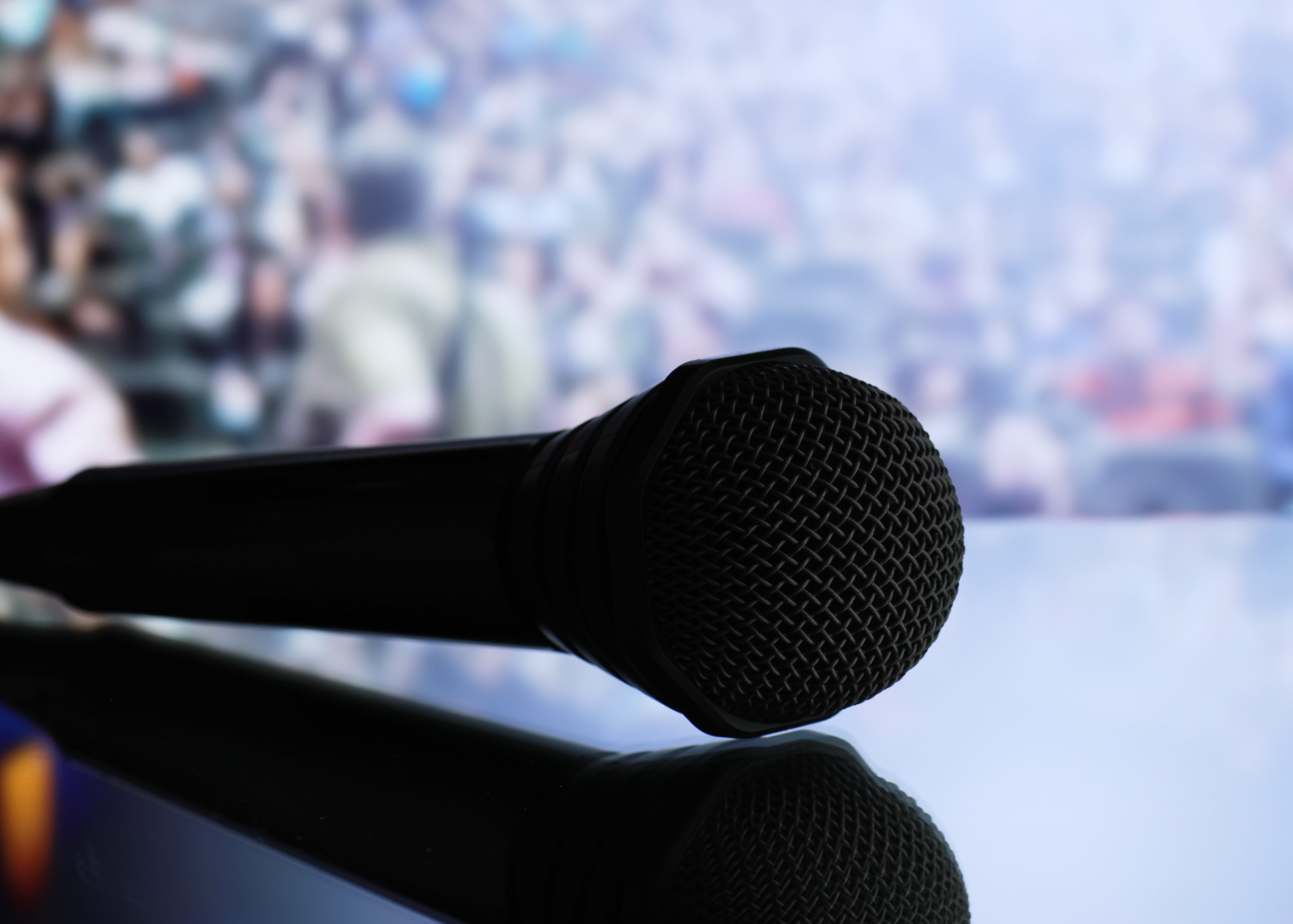 The microphone on the stage in front of the hall. Performance on stage. LINX